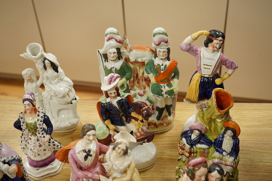 A collection of Staffordshire figures to include some flatback examples, largest 24cm high. Condition - some minor restoration